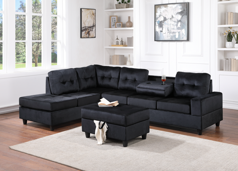 Black velvet reversible tufted sectional with drop down cup holders and storage ottoman