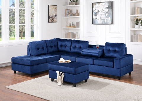 Blue velvet reversible tufted sectional with drop down cup holders and storage ottoman